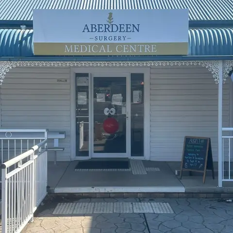 The front door of Aberdeen Surgery decorated with a red nose and smile for Red Nose Day